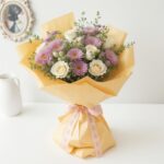 white roses and purple gerbera bouquet